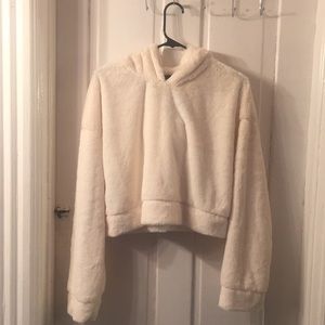 Beige faux fur crop pull over hoodie. Size Large.